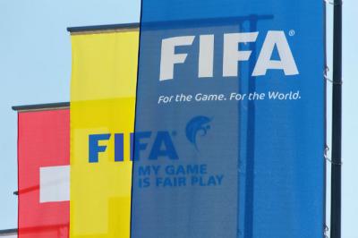 Three FIFA flags aligned. 