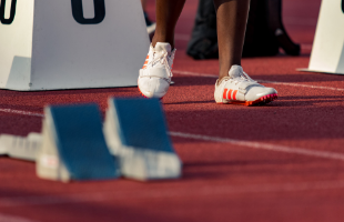 Athlete at start of running track 
