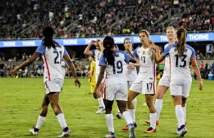 US Female Soccer Players on pitch in full stadium