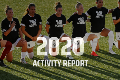 Kneeling female athletes wearing 'Black Lives Matter' t-shirts.