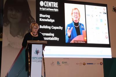 The Centre's CEO standing at podium delivering speech.